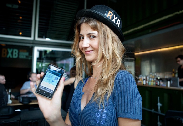 A young woman buys a Bitcoin for 70 euros on the BXB. Hopefully it held ... All image rights by Aaron Koenig.